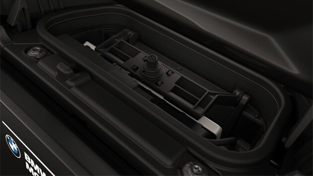 Integrated storage compartment with mobile phone.